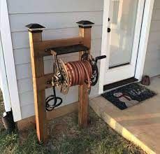 Tip Of The Day Wednesday Hose Reel Stand Garden Hose Holder Garden Hose Storage Backyard Landscaping Designs