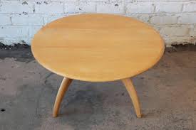 The walnut top rests on an ebonized wooden base with copper socks and a terrazzo stone circle in the centre. Heywood Wakefield Mid Century Modern Wishbone Lazy Susan Round Coffee Table At 1stdibs