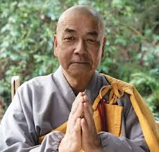 Who Are the Buddhist Monks Walking and Drumming Around Town?