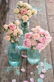 Bottles And Flowers What Could Be More Perfect With Images Shabby Chic Wedding Flower Arrangements Chic Wedding
