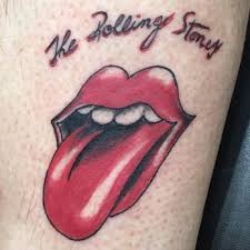 A blue background and music notes really dresses up this rolling stones tattoo. Rolling Stones Tongue Tattoo