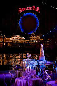 A View Of A Towering Wedding Cake And Paradise Pier At Disney California Adventure Park Disney Wedding Disneyland Wedding Disney Fairy Tale Weddings