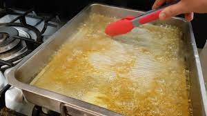 Submerge your greasy exhaust fan filters into the water. Really Works Clean Dirty Hood Filters Easy Using Just Salt Baking Soda Vinegar Boiled Water Youtube