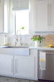 Extending the tiles all the way to the ceiling draws the eye upward and emphasizes the room's height. Kitchen Backsplash Tile How High To Go Driven By Decor