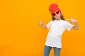 Download Girl In A Red Hat And Glasses In A T Shirt With Mockup On A Yellow Wall Kaos