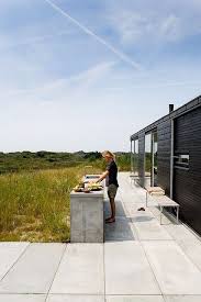Beyond The Barbecue 15 Streamlined Kitchens For Outdoor Cooking Remodelista Modern Outdoor Kitchen Outdoor Kitchen Design Outdoor