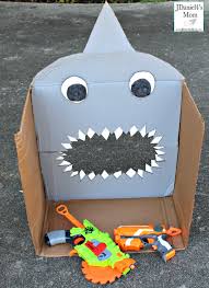 Used various hooks, wood screws, and nails to mount the guns. Diy Nerf Target For Shark Week Jdaniel4s Mom