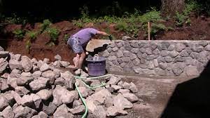 If you an uneven yard, a stone retaining wall can help prevent erosion and now you can start digging. Building Stone Retaining Wall Youtube