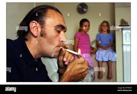 Mark Coombes......smoker planning to stop for his daughters Holly 10 (pink)  and Jessica 7 (blue)pic David Sandison 24/7/2003 Stock Photo