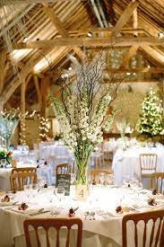 Simple Tall Table Arrangements Created By Eden Blooms Florist At Bury Court Barn Fro Table Arrangements Wedding Tall Wedding Centerpieces Wedding Table Flowers