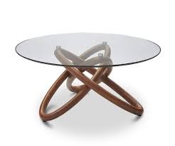 The stainless steel base is secured to a strong pedestal stand in a walnut finish which supports the sleek glass top. Oleander Coffee Table Dania Furniture