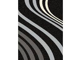 Conforama propose dans sa rubrique tapis des modèles d'inspiration berbère, en laine ou en coton, dans le style beni ouarain (blanc à lignes géométriques noires), azilal (blanc ou écru avec des motifs et lignes géométriques aux couleurs vives), ou encore kilim, avec des fonds colorés et des motifs. Tapis De Salon Conforama Enredada