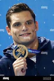 France's gold medal winner Florent Manaudou shows off his medal during the  ceremony for the men's 50m freestyle final at the Swimming World  Championships in Kazan, Russia, Saturday, Aug. 8, 2015. (AP