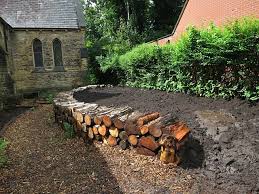 We're here to help bring your landscaping to the next level. Raised Bed With Log Wall Nearly Ready For Planting With Wildlife Friendly Plants And Shrubs Sloped Garden Garden Edge Garden Edging