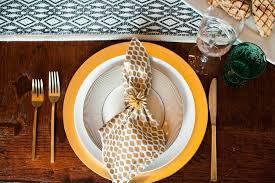 The lower edges of the utensils should be aligned with the bottom rim of the plate, about one (1) inch up from the edge of the table. 7 Super Tips For Hosting A Dinner Party