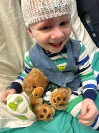 What are the outcomes and experiences of children who have undergone  hemispherectomy surgery?