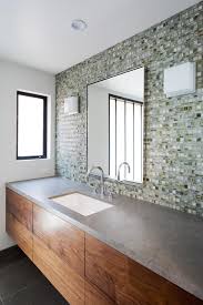 Kate shares 4 ways to create accent walls with tile. Modern Guest Bathroom Detail With Glass Mosaic Tile Wall And Single Sink Vanity Hgtv