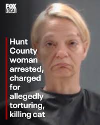 A Hunt County woman has been arrested and charged after allegedly killing a  cat that got into her flower bed