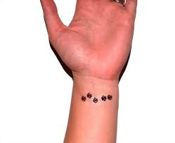 Black paw prints tattoos on left wrist. 50 Animal Paw Print Tattoos Designs Ideas 2021