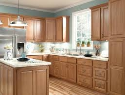 honey oak kitchen cabinets with marble