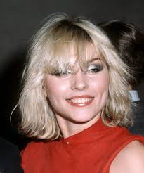 It's hard to miss anyone in the '80s forms of entertainment without this style, especially high school movies and tv shows. 80s Hair Then Now Styles Throwback Curls Bangs Neon