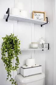 For storing towels, toilet paper and other bathroom items, consider installing a shelf, a cabinet or stacking baskets over the toilet to hold these items. 20 Bathroom Shelf Ideas To Finally Figure Out What To Put Over Your Toilet The Diy Nuts