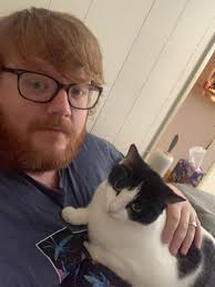 Impulsively got a cute little Valentine's Day flash tattoo and the artist  added some shading to make it look more like my cow cat!