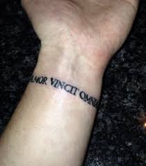 Check spelling or type a new query. Wrist Tattoo Amor Vincit Omnia Love Conquers All Tattoos Wrist Tattoos Tattoos For Guys