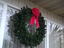 Stylish christmas wreath with fir branches and lights at front w. How To Hang A Wreath On A House Youtube