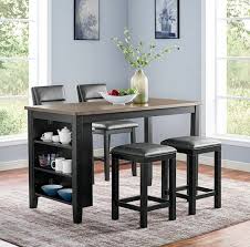 This sturdy wooden counter storage table has three open shelves that are accessible from two sides. Kearney Storage Counter Height Dining Table