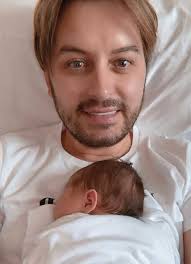 Daddy Brian and Papa Arthur shower baby Blake with love