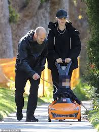 Jason statham is an english actor, martial artist, producer and former diver. Rosie Huntington Whiteley Enjoys Family Day Out With Jason Statham And Toddler Son Jack Daily Mail Online