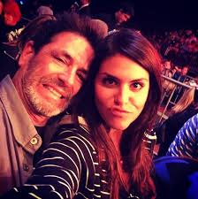 Amanda Zuckerman and Evel Dick watch Jessie wrestle