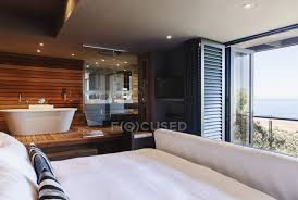 Check spelling or type a new query. Modern Master Bedroom And Bathroom Overlooking Ocean Soaking Tub Scenic View Stock Photo 199885654