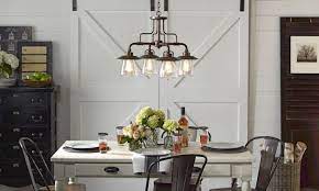 Distressed with wood and anvil iron with driftwood. Dining Room Chandelier Wild Country Fine Arts