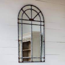 Anytime you introduce arches, home improvement projects become much more this job entailed installing a pair of custom, wrought iron, arched entry doors that the homeowner bought at a home show for his new house. Arched Iron Mirror Iron Accents