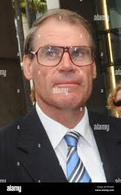 In this Jan. 27, 2010 photo, barber Willie Pearson displays his New Orleans  Saints tattoo in Impressive Barber Shop in New Orleans. A lifelong Saints  fan, he got the tattoo after the