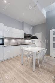 Chic antique style kitchen cabinets of wooden materials in white and cream. Elegant Kitchen With Gray Walls And White Furniture And Simple Stock Photo Picture And Royalty Free Image Image 148903391