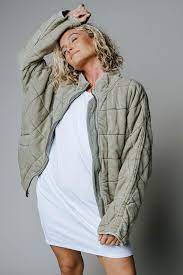 Unique dolman sleeves, topstitched welt pockets, and a cropped hem make this jacket a instant classic. Free People Dolman Quilted Knit Jacket In Pine Slumber
