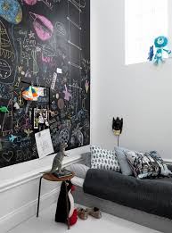 Whether it's feminine or masculine, farmhouse or industrial a small nordic bedroom with a chalkboard wall and a white floor, black and white bedding, a stack of magazines as a nightstand. 32 Chalkboard Decor Ideas