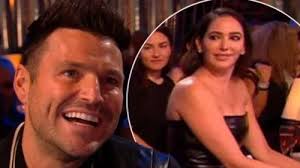 Mark Wright looks overwhelmed with emotion as he gazes at Megan McKenna  singing