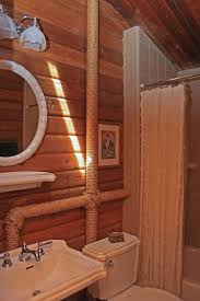 Hiding a sink that's in the bedroom : This Has To Be The Coolest Idea I Ve Seen For Disguising Pipes I Love It Hide Pipes Basement Laundry Room Laundry In Bathroom