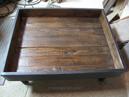 A metal tub topped with a round wood could mimic the look of a spool! Vintage Door Coffee Table Diy My Repurposed Life Rescue Re Imagine Repeat