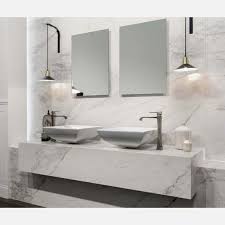 Using marble in a bathroom is problematic because of the maintenance you have to put in to keep it as immaculate as it was when first installed. Carrara White Matt Marble Porcelain Wall And Floor Tile Tiles From Tile Mountain