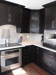 If you are looking for countertops that will totally contrast your white cabinets, black quartz can give you what you desire. Black Kitchen With White Counters Dark Kitchen Cabinets Black Kitchen Cabinets Black Kitchens