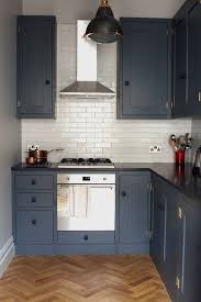 You can choose light gray to make the kitchen more spacious or dark gray color to create a smaller and lighter atmosphere. Dark Gray Kitchen Cabinets Stunning Traditional Dark Gray Cabinet Kitchen Features Dark Gray Cabinetry Paired Large White Island With Dark Gray Kitchen Cabin Small L Shaped Kitchens Kitchen Design Dark