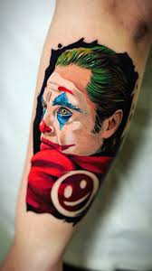 Smile through the pain. 🎭Full-color Joaquin Phoenix Joker tattoo. ,  #PutOnAHappyFace #JokerTattoo #FullColorInk