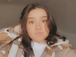 Who can color correct and bring back natural brunette hair color in Muncie?