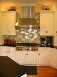 Beautiful White Kitchen Cabinets With Ventilation Hood Metallic Stone Backsplash Kenwood Kitchens Kitchen Remodel Design Beautiful Kitchens Kitchen Remodel