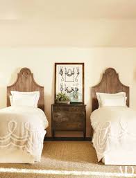 Photo also showed a barn door into bath. How To Decorate With Two Twin Beds Guest Room And Kids Bedroom Ideas Architectural Digest